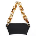 Black faux leather coffee cup sleeve featuring a trendy amber acrylic chain handle strap - Black with Amber Chain