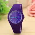 Close-up of a minimalist purple silicone quartz watch with light blue markers. - Purple