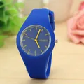 Close-up of minimalist blue silicone quartz watch with yellow markers and jelly design - Blue