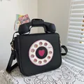 Unique vintage telephone shaped black PU leather crossbody bag with pink heart detail - Large / 23x20x11cm / Black