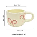 Ceramic bow tie mug dimensions: 300ml capacity, 10cm diameter, cream and pink design. - 300ml / Pink