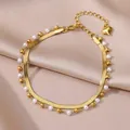Detailansicht einer luxuriösen goldenen Edelstahl-Fußkette mit Perlen und Herzanhänger - Künstlicher Perlen-Herzanhänger-Stil (HJ362G)