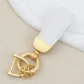 Elegant white goat grain leather car keychain with luxury gold-tone hardware details - Independent Matte Bag Packaging / Pearl Gold-White