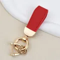 Elegant red leather car keychain with gold metal hardware and goat grain texture detail - Independent Matte Bag Packaging / K Gold-Red