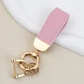 Elegant pink goat grain leather keychain with gold-toned metal rings for car keys - Independent Matte Bag Packaging / K Gold-Pink