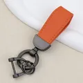 Orange goat grain leather car keychain with dark gray metal rings and horseshoe buckle. - Independent Matte Bag Packaging / Pearl Matte Gun-Orange