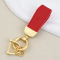 Elegant red goat-grain leather car keychain with matte gold hardware for bag decoration - Independent Matte Bag Packaging / Pearl Gold-Red