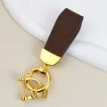 Premium brown goat grain leather car keychain with polished gold hardware variant - Independent Matte Bag Packaging / Gold-Coffee