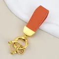 Orange goat grain leather car keychain with luxury gold horse hoof buckle variant - Independent Matte Bag Packaging / Gold-Orange
