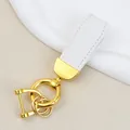 Premium white goat grain leather car keychain with elegant gold-tone hardware for bags - Independent Matte Bag Packaging / Gold-White