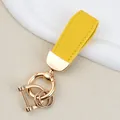 Yellow goat-grain leather keychain with elegant gold-tone hardware and versatile ring clips - Independent Matte Bag Packaging / K Gold-Yellow