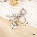 Elegant silver metal keychain featuring a bow design and heart pendant bag charm accessory - Small Pendant / Smooth Heart Charm(K6030)
