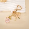 Pink acrylic strawberry keychain pendant with golden bow and heart-shaped metal clasp - Small Pendant / Pink Transparent Strawberry Charm(K6024)