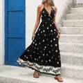 Elegantes schwarzes Maxikleid mit Blumenmuster und Neckholder für den Sommerurlaub - S / Schwarz