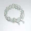 Forest style beaded bracelet featuring light green crackle glass beads and silver flower charms - Crystal Rose Green