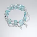 Sweet light blue cracked crystal bead bracelet featuring rose and delicate flower charms - Crystal Rose Blue