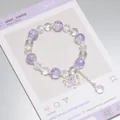 Elegant purple and clear crystal beaded bracelet featuring an iridescent butterfly charm - Sparkling Butterfly Ice Purple