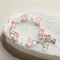 Sweet forest style pink and clear crystal beaded bracelet featuring a lovely butterfly charm - Butterfly Bell Ice Bracelet Pink
