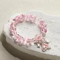 Handmade pink crystal beaded bracelet featuring a sweet moon and fish tail charm for women. - Dreamy Fish Tail Bracelet Pink