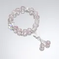 Elegant pink crystal beaded bracelet featuring a silver butterfly charm and tassels - Dancing Butterfly Pink