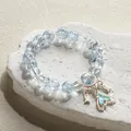 Light blue crystal beaded bracelet with fishtail charm on rock - Dreamy Fish Tail Bracelet Blue