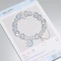 Light blue forest style crystal beaded bracelet with silver moon and butterfly charms - Galaxy Butterfly Bracelet Blue