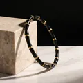 Elegante brazalete de lujo en acero inoxidable con nudos de bambú negro y dorado - Pulsera de Bambú Negro