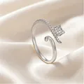 Elegant adjustable silver cat ring with sparkling zircon stones on satin background - Clever Cat Wrap Style (7427)
