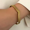 Elegant vintage bohemian gold-toned stainless steel bracelet with filigree loops - Wave Hollow Out (X296)