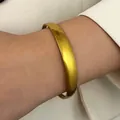 Elegant polished gold stainless steel vintage bangle bracelet for minimalist styling - Ring Arch (K-541)