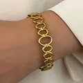 Elegant vintage gold-plated stainless steel oval link bracelet worn on a wrist detail - Oval Chain Link (G-544)