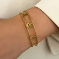 Gold beaded stainless steel bracelet with vintage wavy pattern worn on wrist for SKU. - Beaded Wave (6645)