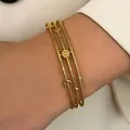 Vintage bohemian gold stainless steel triple-layered bracelet featuring sun, moon and star charms - Star Moon Pendant (X849)