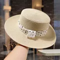 Elegant women's straw sun hat with a charming black polka dot ribbon bow decoration. - Beige Polka Dot Strap Flat Top Hat (D-0071)