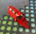 Detailed view of a red punk style articulated finger claw ring with a textured pointed tip - Two-Section / Red