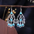 Bohemian silver tassel earrings featuring vibrant turquoise beads and crystals - Silver