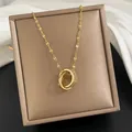 Elegant gold interlocking double-ring pendant necklace with sparkling crystal pavé details - 156#XL1470-56