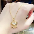 Elegant gold-tone stainless steel necklace featuring a traditional crystal lock pendant - 160#xl1780-42 Titanium Steel With Real Gold Plating