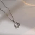 Elegant silver star pendant necklace with sparkling stones on soft cream fabric backdrop. - 164#xl1783-72 Silver