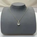 Elegant gold-tone necklace with a shimmering crystal star pendant on a grey bust. - 169#xl1867-29zx591 Gold