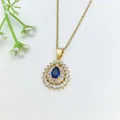 Elegant gold necklace with a deep blue teardrop gemstone and crystal halo pendant detail - 195#XL1200-407