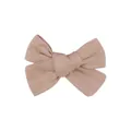 Detail view of a handmade linen fabric bow hair clip in natural beige color for kids - Apricot Cotton Linen Bowknot