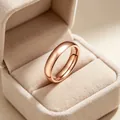 Elegant 4mm rose gold 316L stainless steel band ring presented in a beige velvet box - Size 5 / Plain Style / Rose Gold