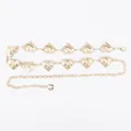 Elegant golden metal waist chain featuring textured heart-shaped charms for dresses. - Plissé Large Heart Metal Waist Chain (Gold)