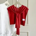 Elegant red wool knit shawl capelet featuring a thin fashionable knotted design - Brick Red