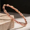 Detailed view of an elegant rose gold bamboo node bangle made from durable titanium steel. - Rose Gold Round Bamboo Bangle (14-B-6)
