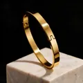 Minimalist 8mm wide gold stainless steel bangle with a smooth polished finish buckle - 6mm Width Oval / Gold