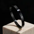 Minimalist black glossy stainless steel bangle with clasp, 8mm wide, variant view. - 6mm Width Oval / Black