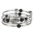 Close-up detail of bohemian multi-layer silver-tone wrap bracelet with black bead accents. - Black Obsidian
