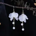 Elegant white translucent flower petal earrings with pearl tassels in gold finish. - Gold Thin Long Tassel Artificial Pearl Style (E5931/Gold)